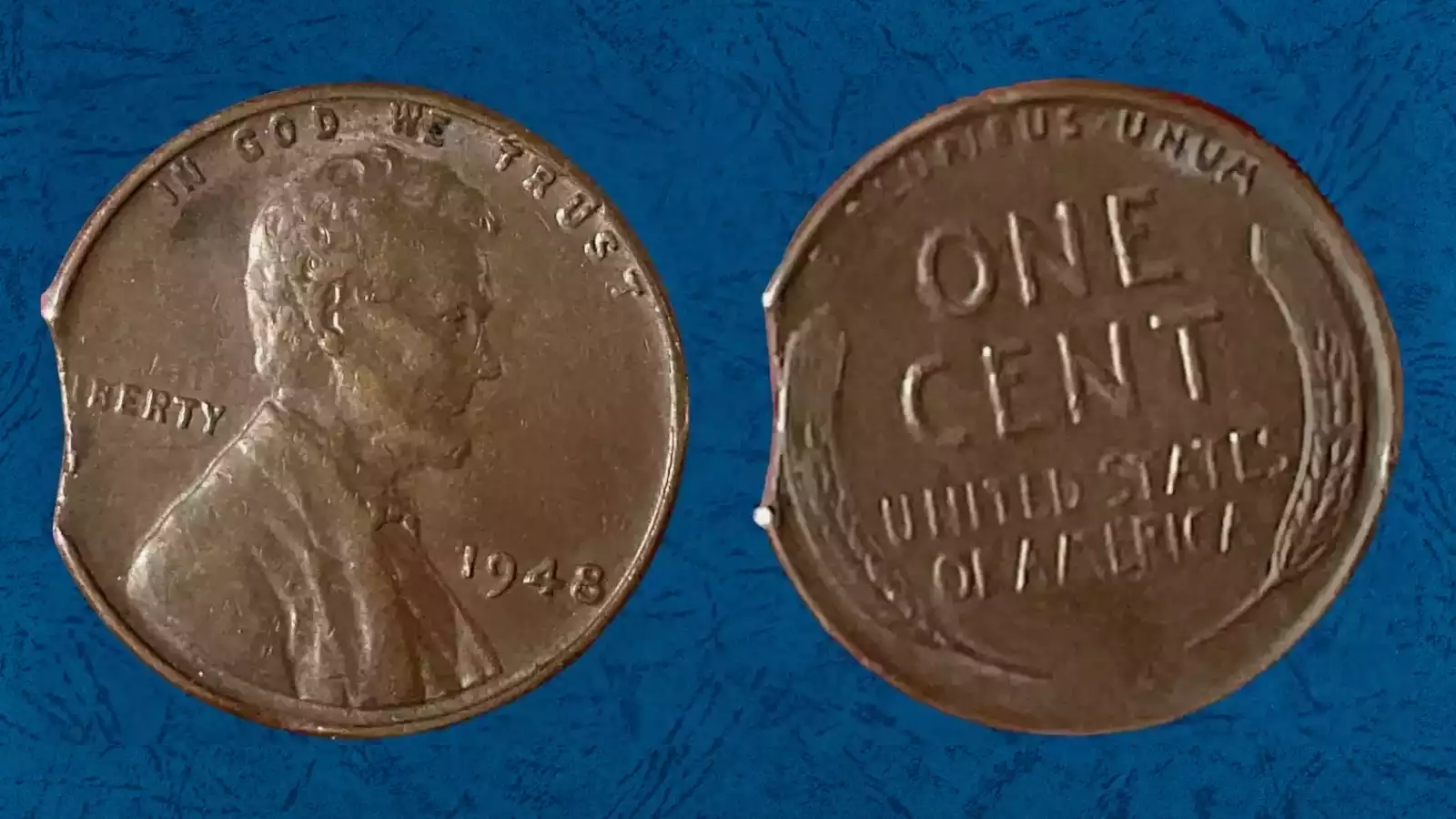 1948 wheat penny clipped planchet error showing curved crescent-shaped piece missing from the coin's edge
