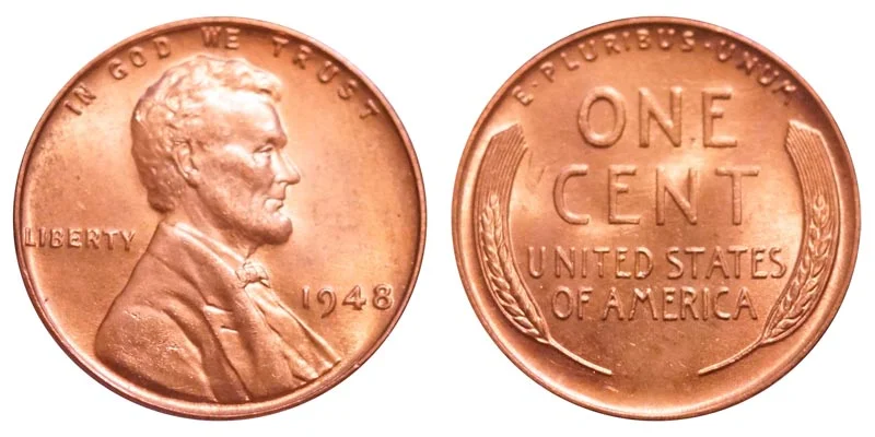 Grading strip showing four 1948 wheat pennies progressing from heavily worn Good condition to full Mint State Red gem